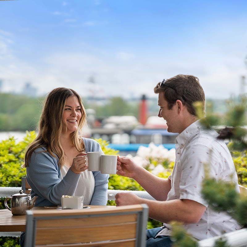 Couple having coffee on patio