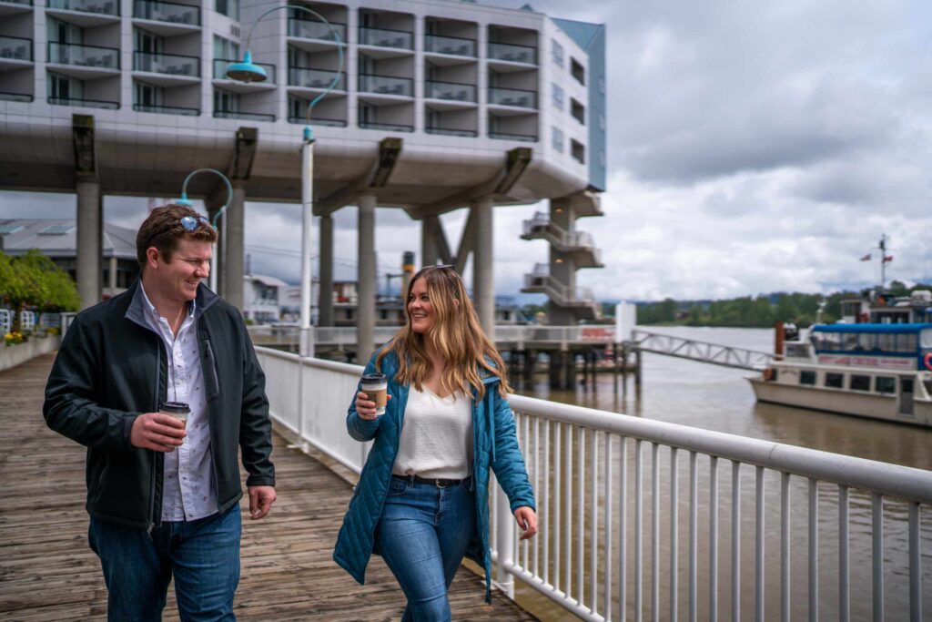 Couple walking at boardwalk in New Westminster, BC