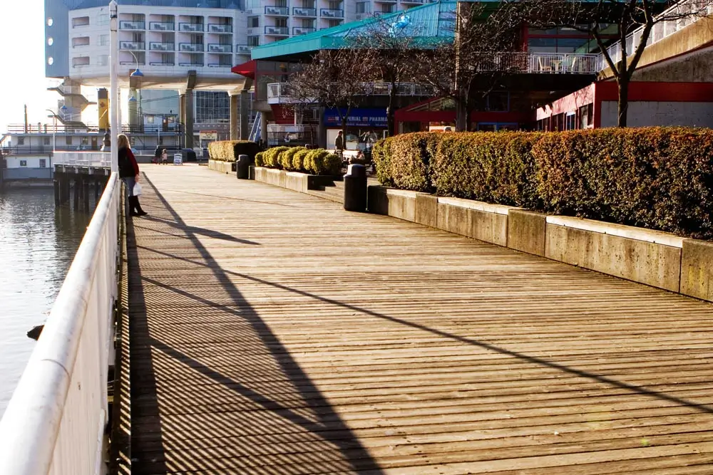 early morning on boardwalk with sun rising behind hotel