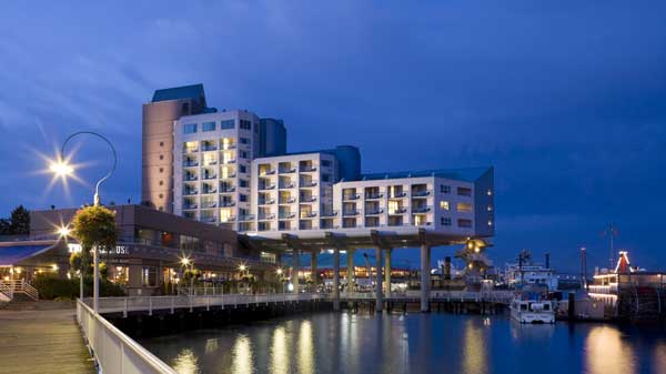 Exterior view of hotel from boardwalk at dusk